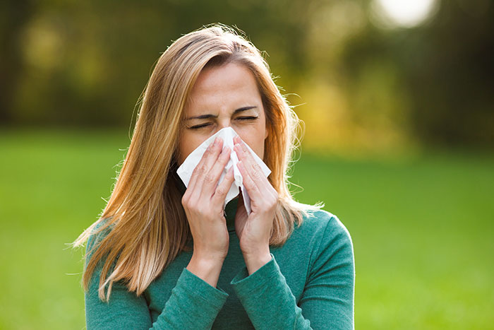 woman with allergies outside